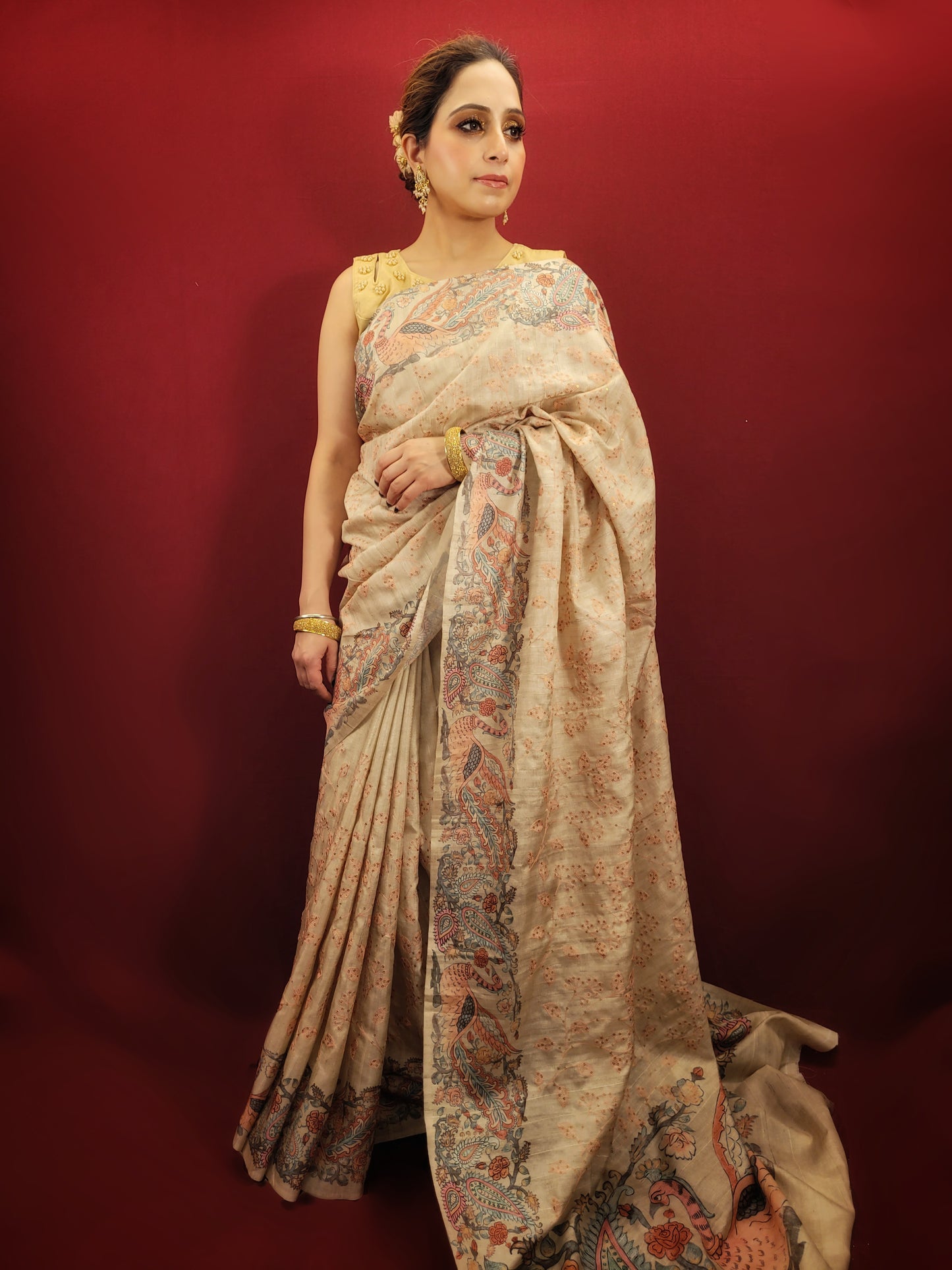 This Silk Saree in Beige color is elegantly woven with resham & some schiffli work on it. It has an unstitched blouse in beige color.