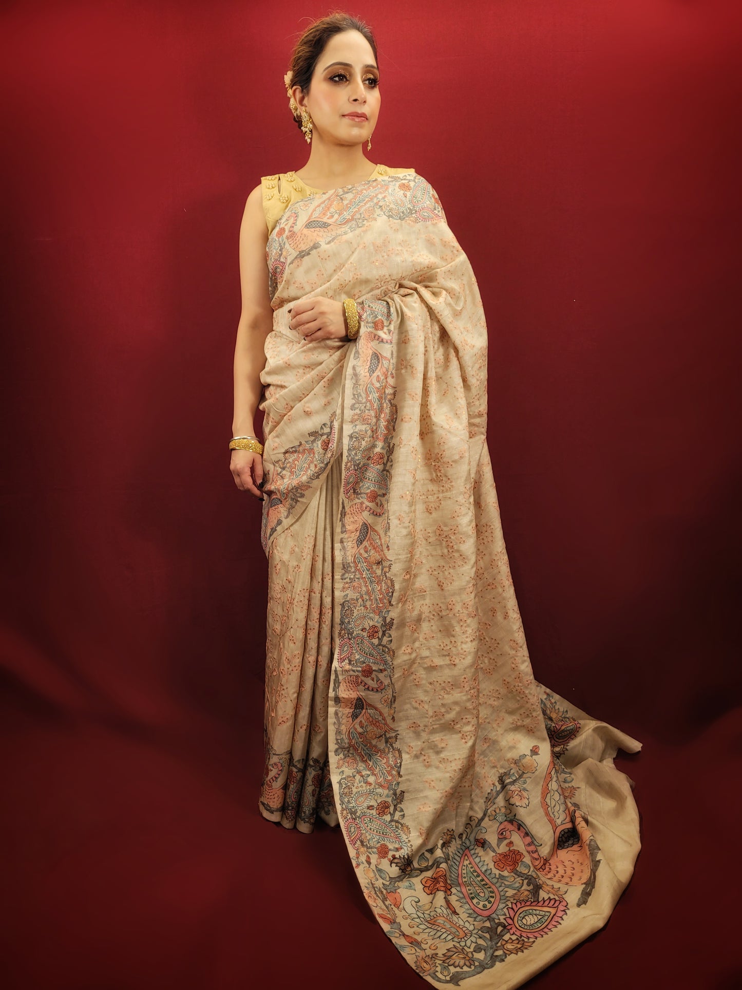 This Silk Saree in Beige color is elegantly woven with resham & some schiffli work on it. It has an unstitched blouse in beige color.