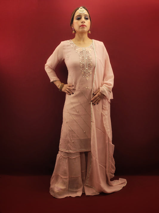 Adorned with delicate beads and threads on pink georgette, this gharara set is the epitome of party wear elegance.