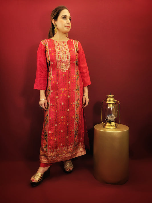 Add a touch of timeless elegance to your ethnic wear collection with this stunning red kurti pant dupatta set. The kurti boasts a beautiful multicolored Banarasi weave, intricately detailed with handwork that speaks volumes of Indian craftsmanship. Made from soft and breathable muslin, the kurti drapes beautifully, while the contrasting chiffon dupatta adds a touch of flowy grace.