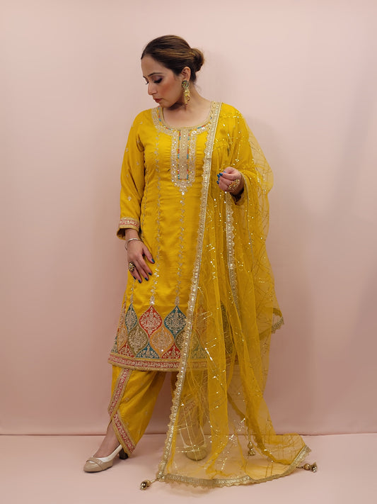 The long-sleeved kameez is paired with a simple yet sophisticated salwar, providing a balanced look that complements the ornate top. Completing the outfit is a matching yellow dupatta, embellished with similar embroidery and beadwork along its borders, adding a graceful touch to your attire.