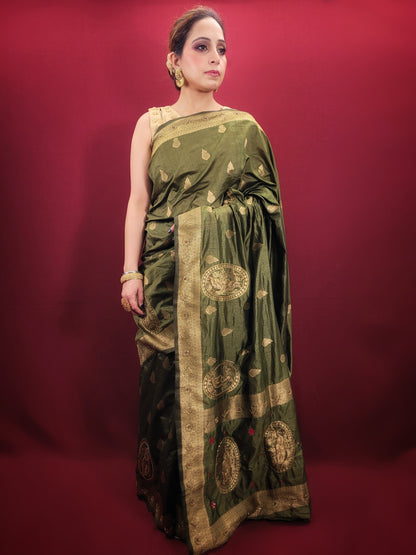 Looking for a stunning piece of clothing that will make you stand out at any festive occasion or mehendi ceremony? Look no further than this beautiful silk saree, expertly crafted with intricate woven work and cutdana bead detailing that catches the light and adds a touch of glamour to any outfit.