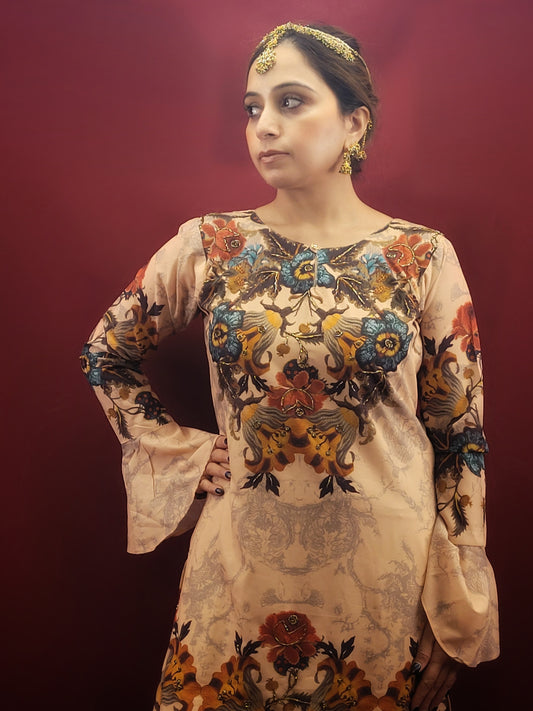 A fusion of elegance and artistry, this stunning beige georgette kameez sharara set is perfect for unforgettable evenings. The captivating digital print boasts a unique charm, while the delicate glass bead highlights add a touch of luxurious shimmer. The flowy georgette fabric drapes beautifully, creating a silhouette that flatters all body types.